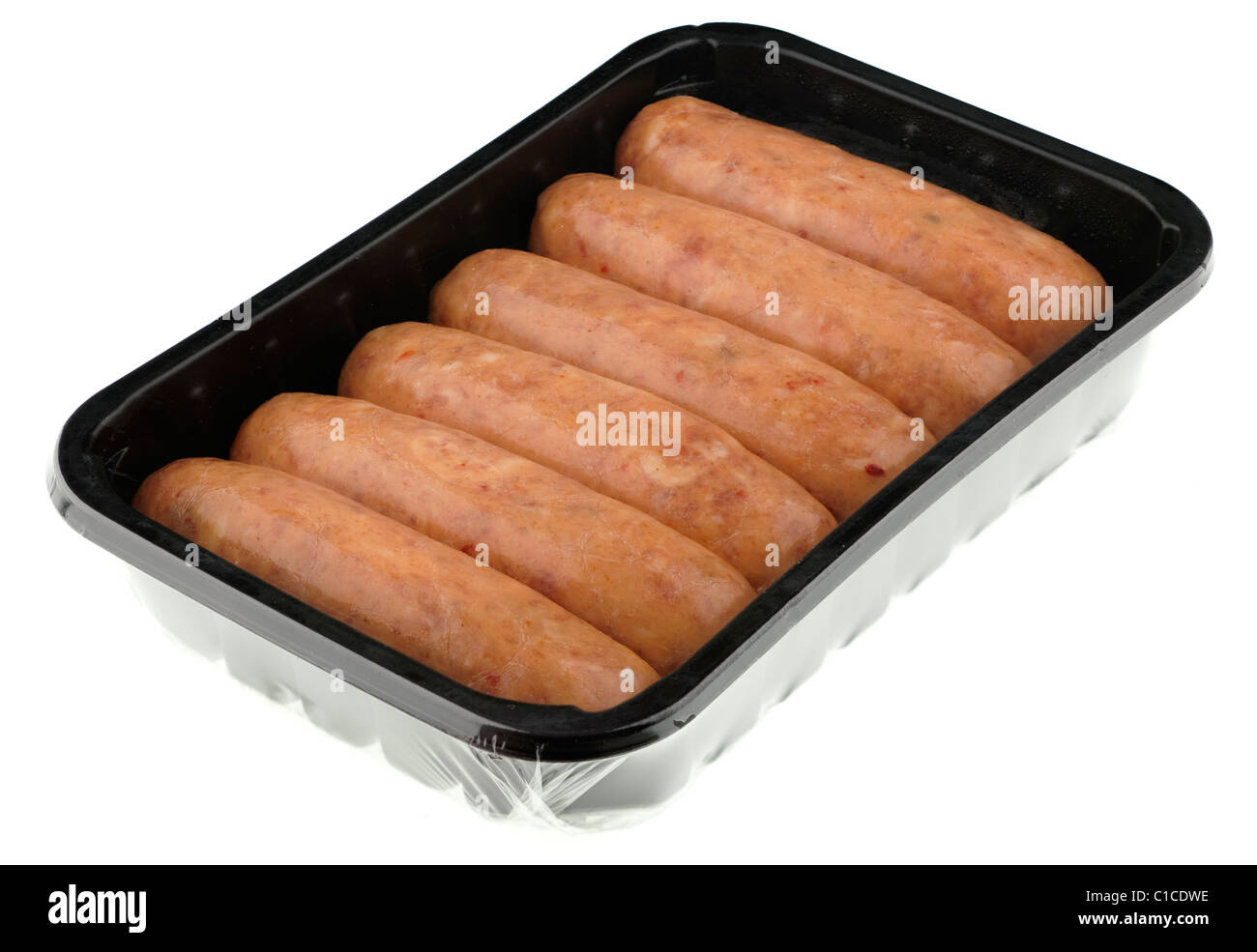 Six sweet chilli  sausages in a plastic tray covered with clear cellophane wrapping Stock Photo