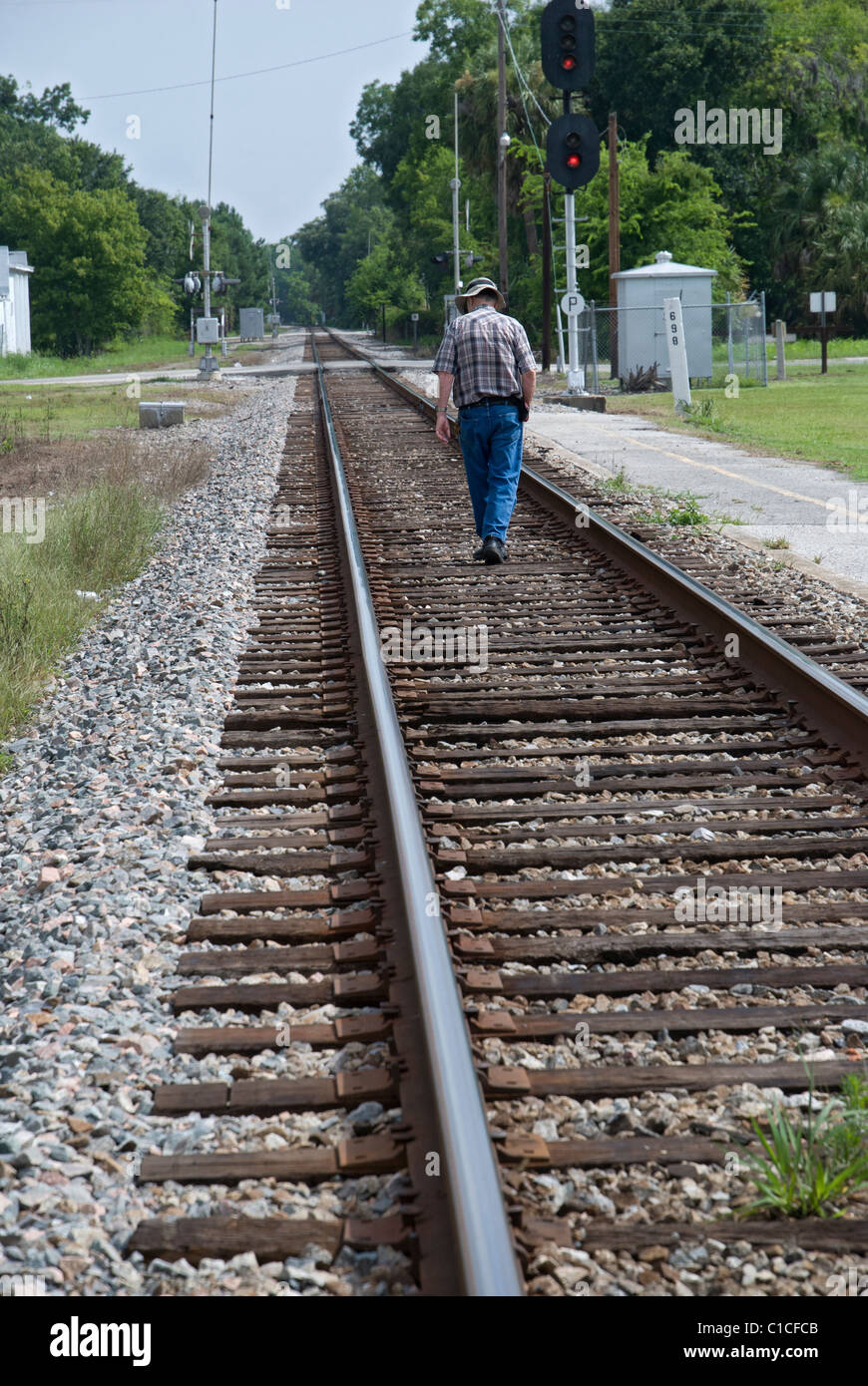 man walking the railroad tracks Palatka Florida Stock Photo Alamy