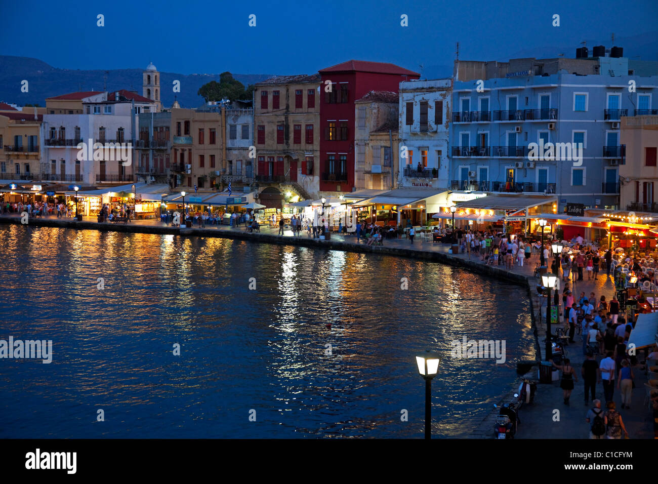 Chania Harbour evening restaurants Crete Greece Europe Stock Photo