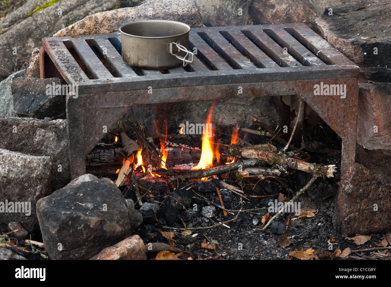 Cooking over a fire on a U.S. Forest Service grill in the Boundary