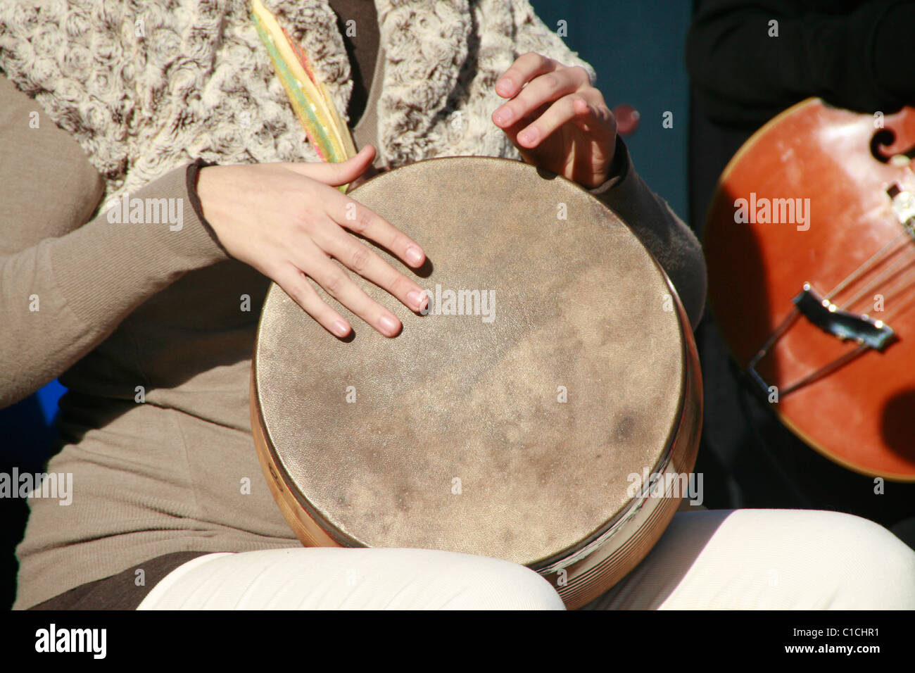 Sun Musical Instruments detail of person with musical instrument outdoors in sun Stock Photo ...