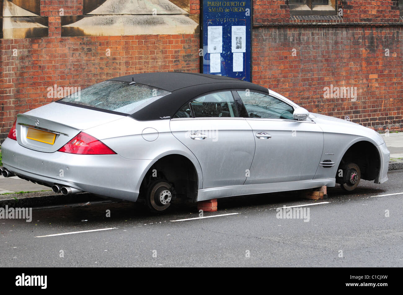 An 80 000 Mercedes Cls Convertible Is Propped Up With Car Jacks Stock Photo Alamy