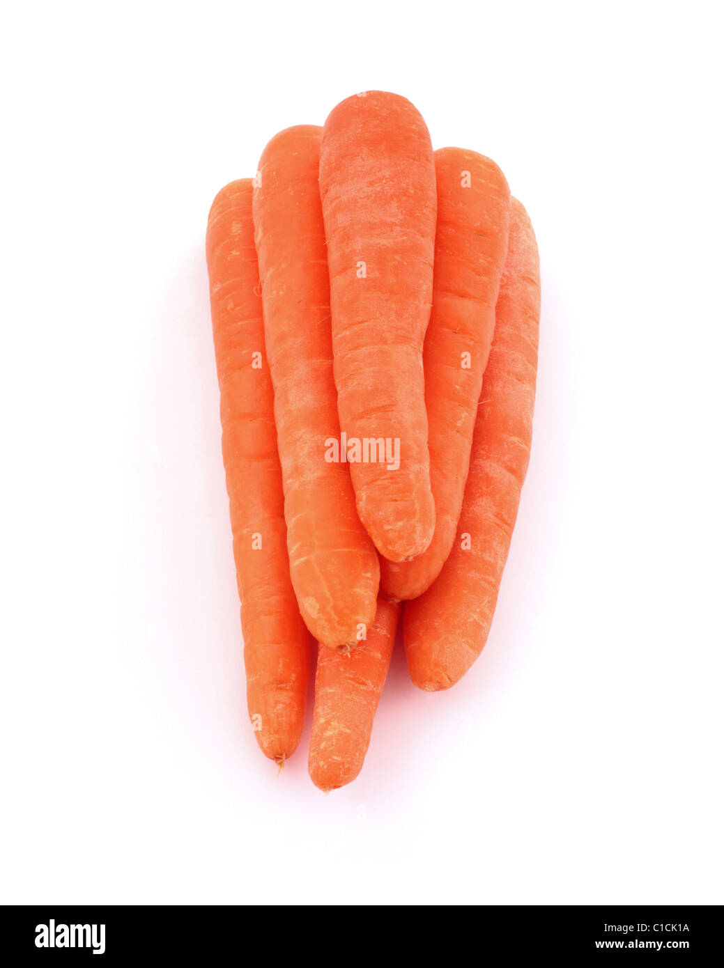 A pile of carrots on a white background. Stock Photo