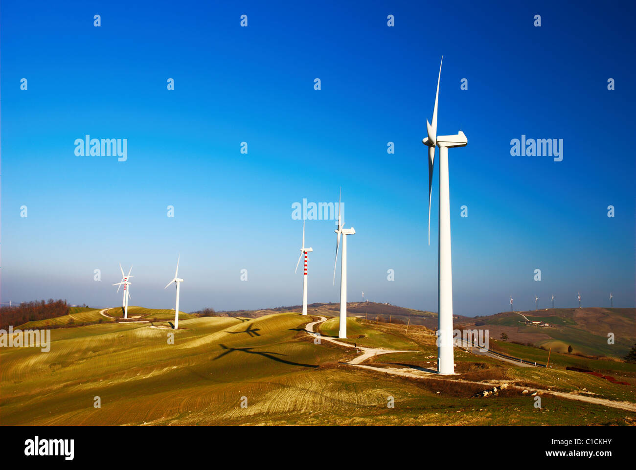 Modern and ecologic generators on top of a hill Stock Photo