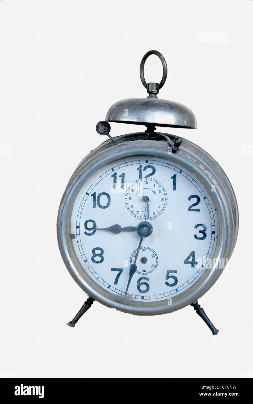 Silver old mechanical alarm clock on a white background Stock Photo - Alamy