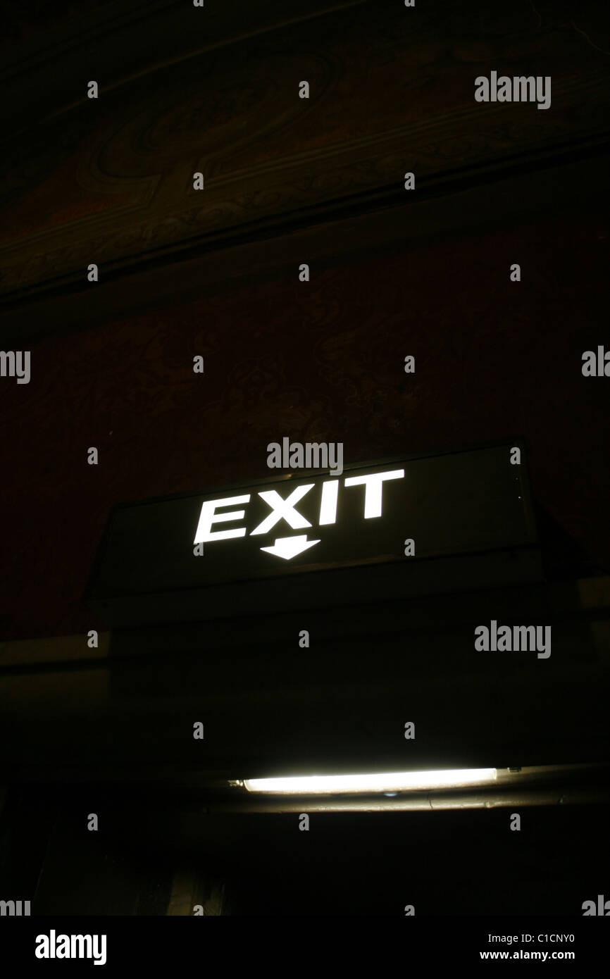 illuminated exit sign notice arrow above door Stock Photo Alamy