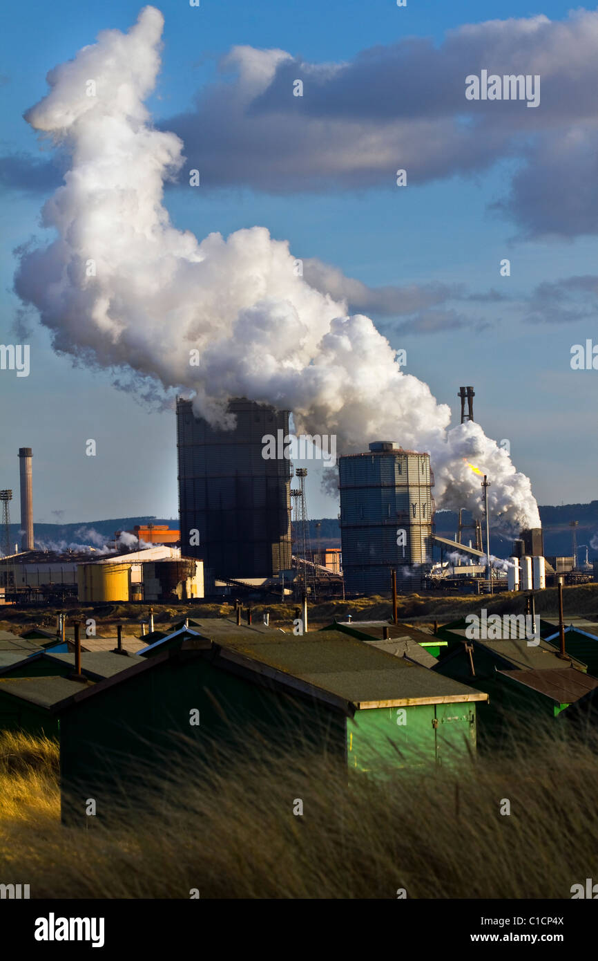 Several Tarpaulin roofed Fisherman's huts with chimneys; A hundred “South Gare Fishermen’s Association” cabins. Multiple sheds with doors & windows Stock Photo