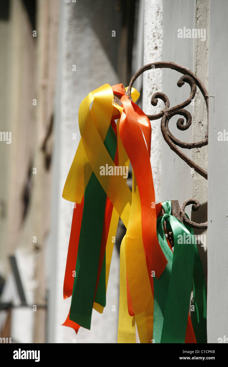 colourful carnival ribbons on wall in city town Stock Photo - Alamy