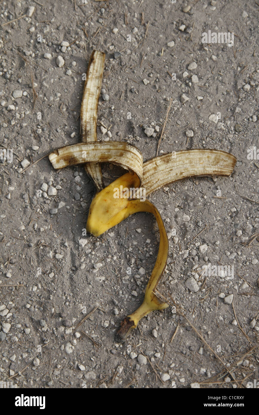 one banana peel left thrown on street in town Stock Photo - Alamy