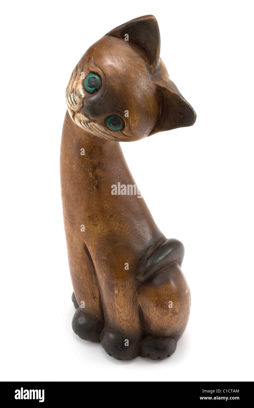Wooden cat with green eye insulated on white background Stock Photo - Alamy