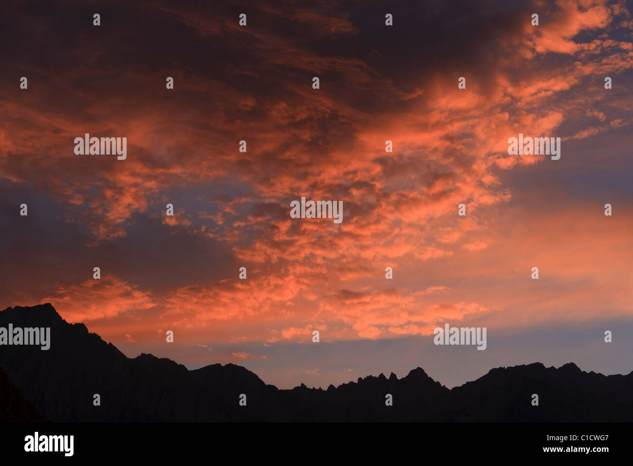 Fiery clouds and sky over eastern-Sierra crest, California, USA. Stock Photo