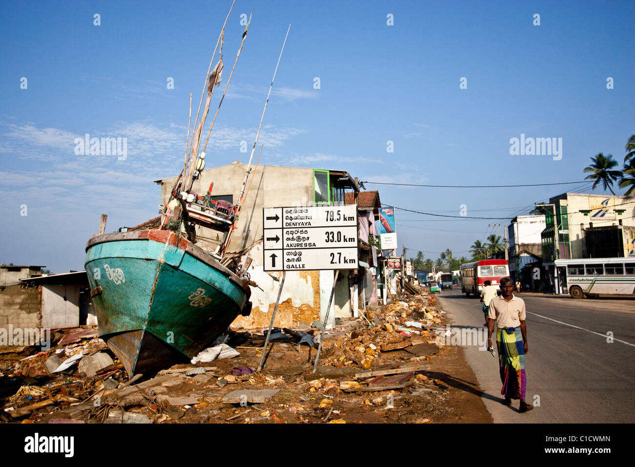 A boat sits where a shop used to, after the Tsunami that hit Sri Lanka in December 2004. Stock Photo