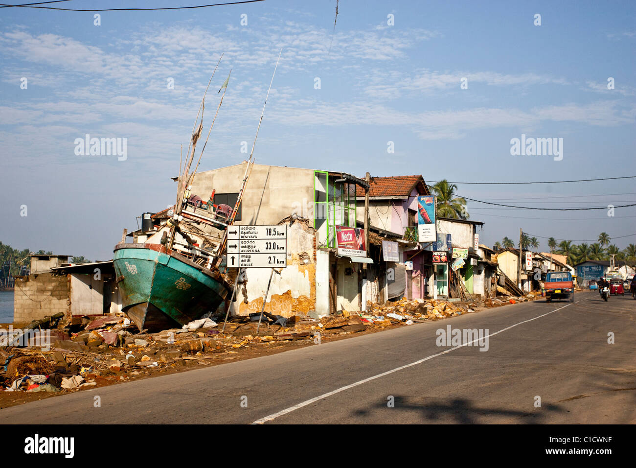 A boat sits where a shop used to, after the Tsunami that hit Sri Lanka in December 2004. Stock Photo
