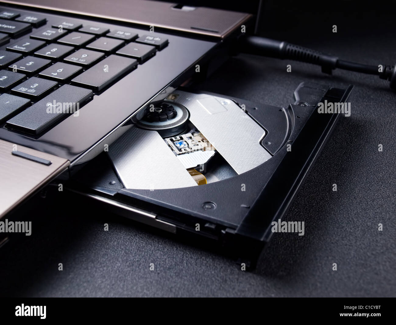 Open optical disc drive on a modern laptop computer without disc Stock