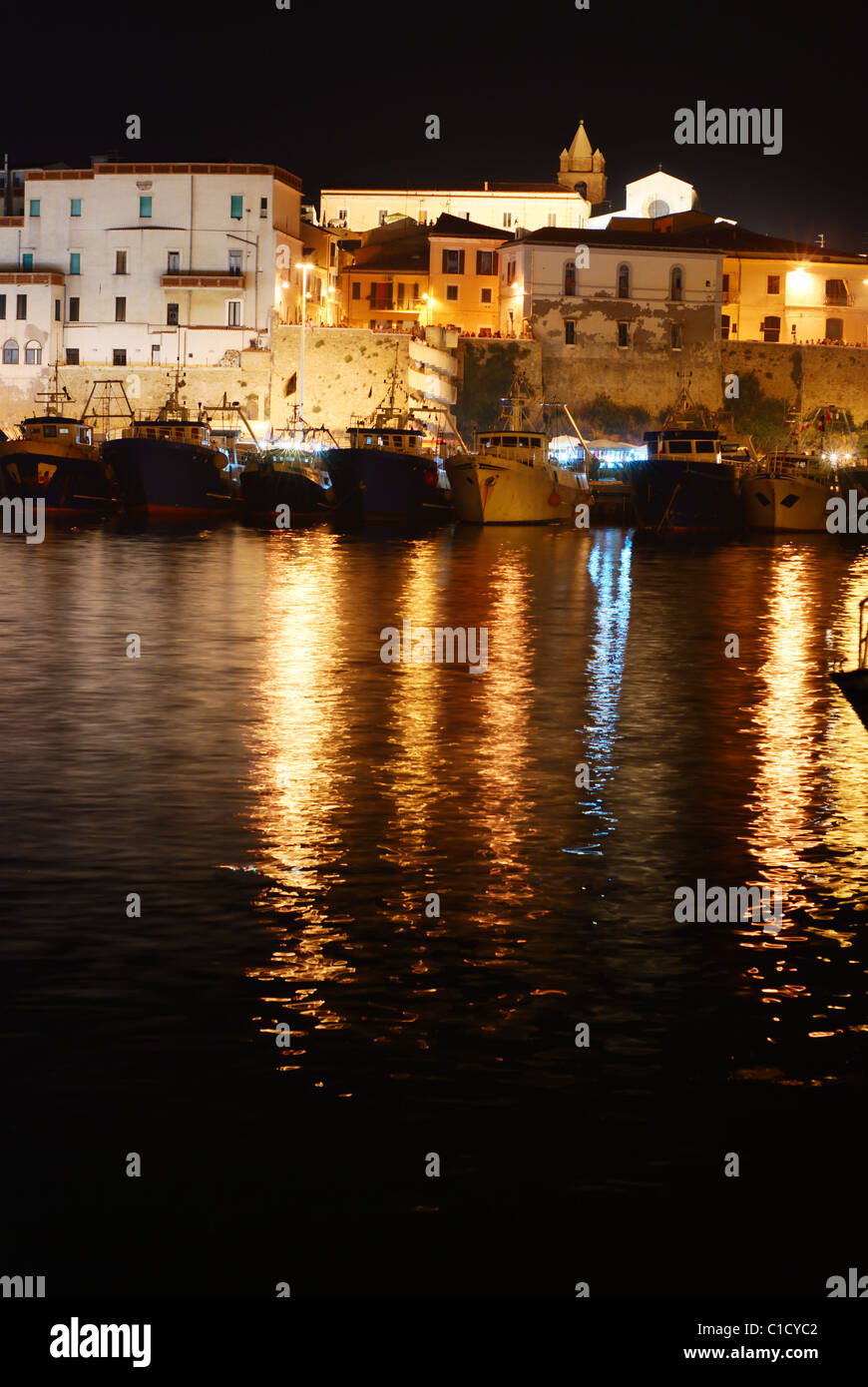 Old town of Termoli with it's harbor by night Stock Photo