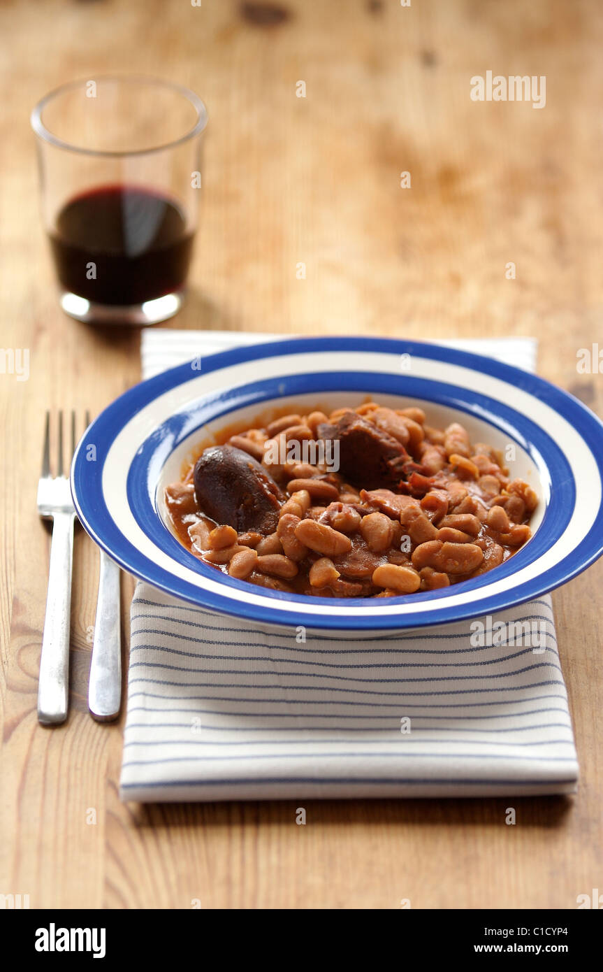 Traditional French cassoulet stew with a glass of red wine Stock Photo