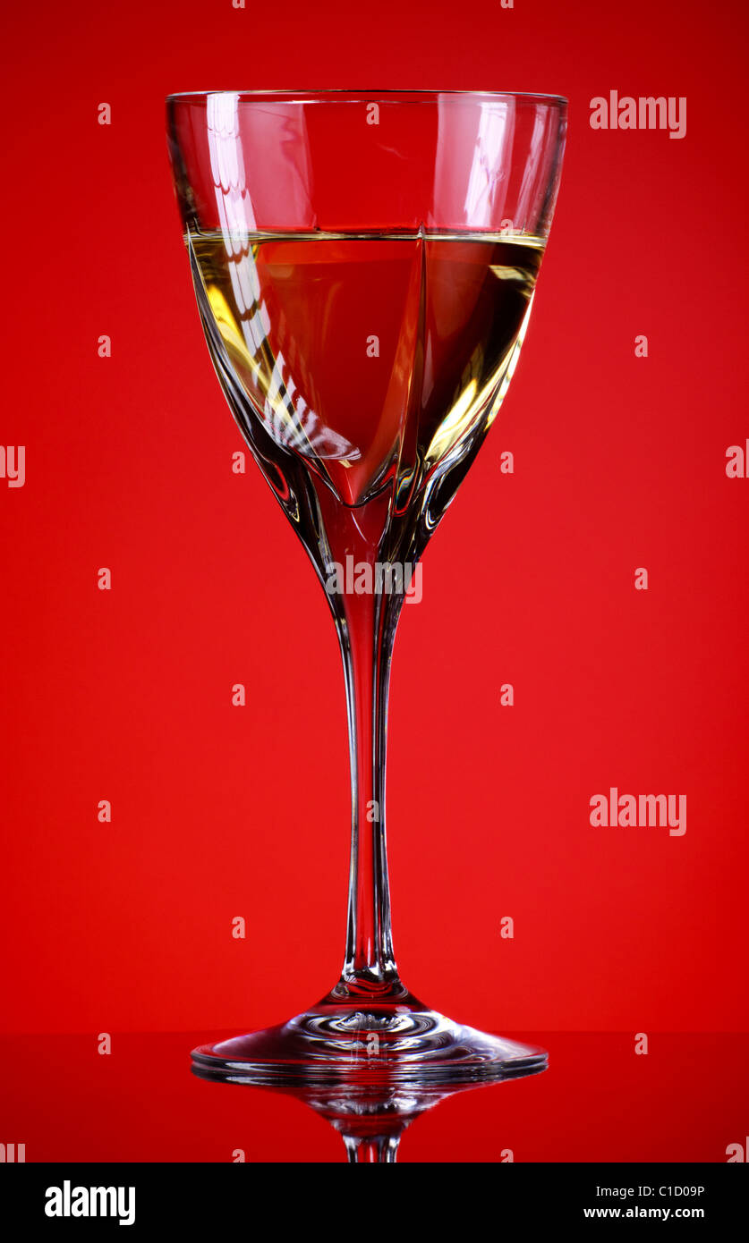 https://c8.alamy.com/comp/C1D09P/glass-of-white-wine-red-background-C1D09P.jpg