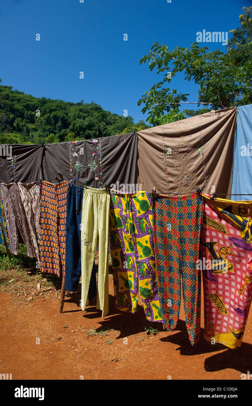 Madagascar, Island of Nosy Komba (next to Nosy Be) fishing village of Ampangoriana. Typical textiles & colorful pants for sale. Stock Photo