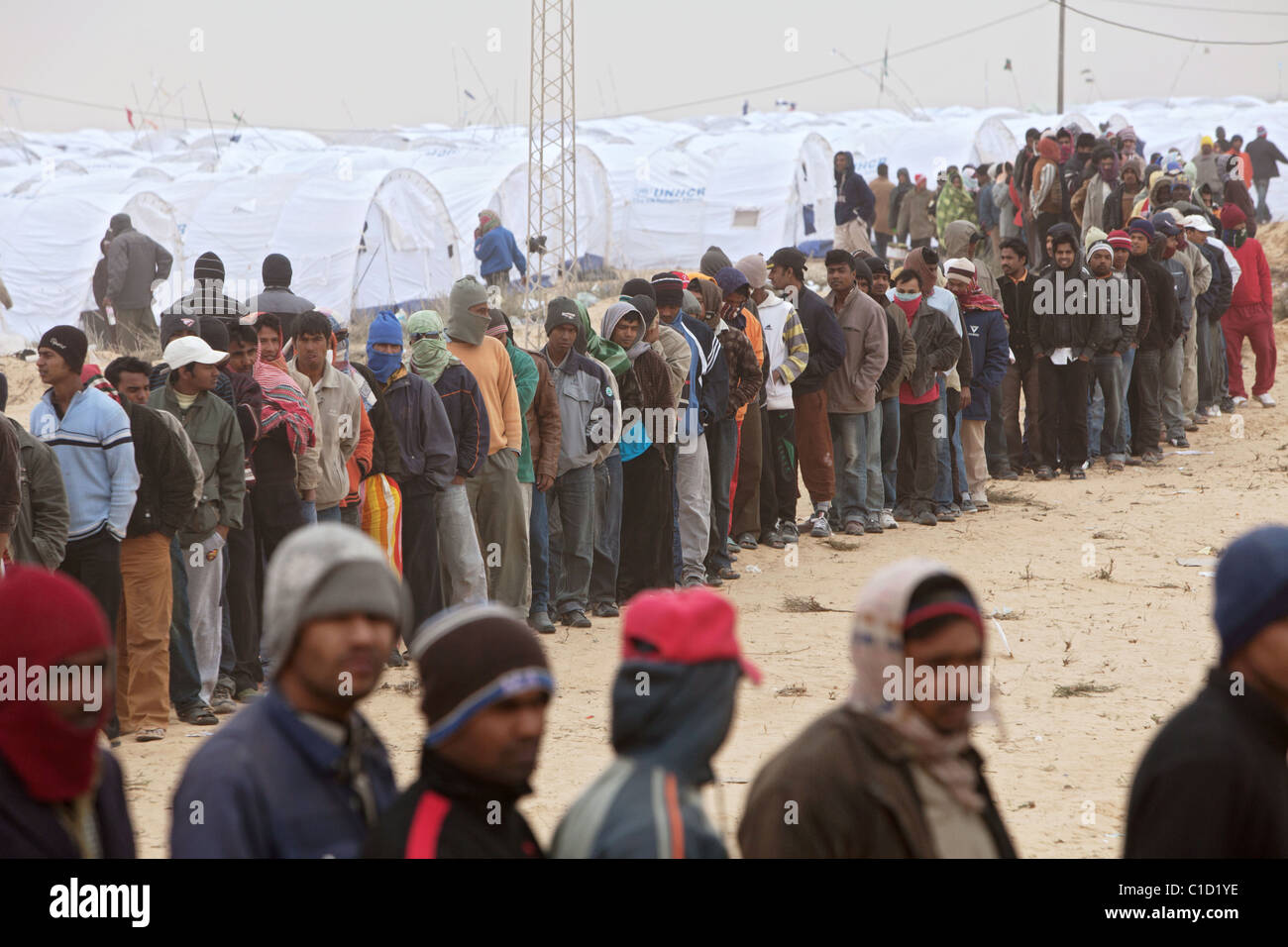 Refugees in the Shousha refugee camp waiting for food distribution, Ben