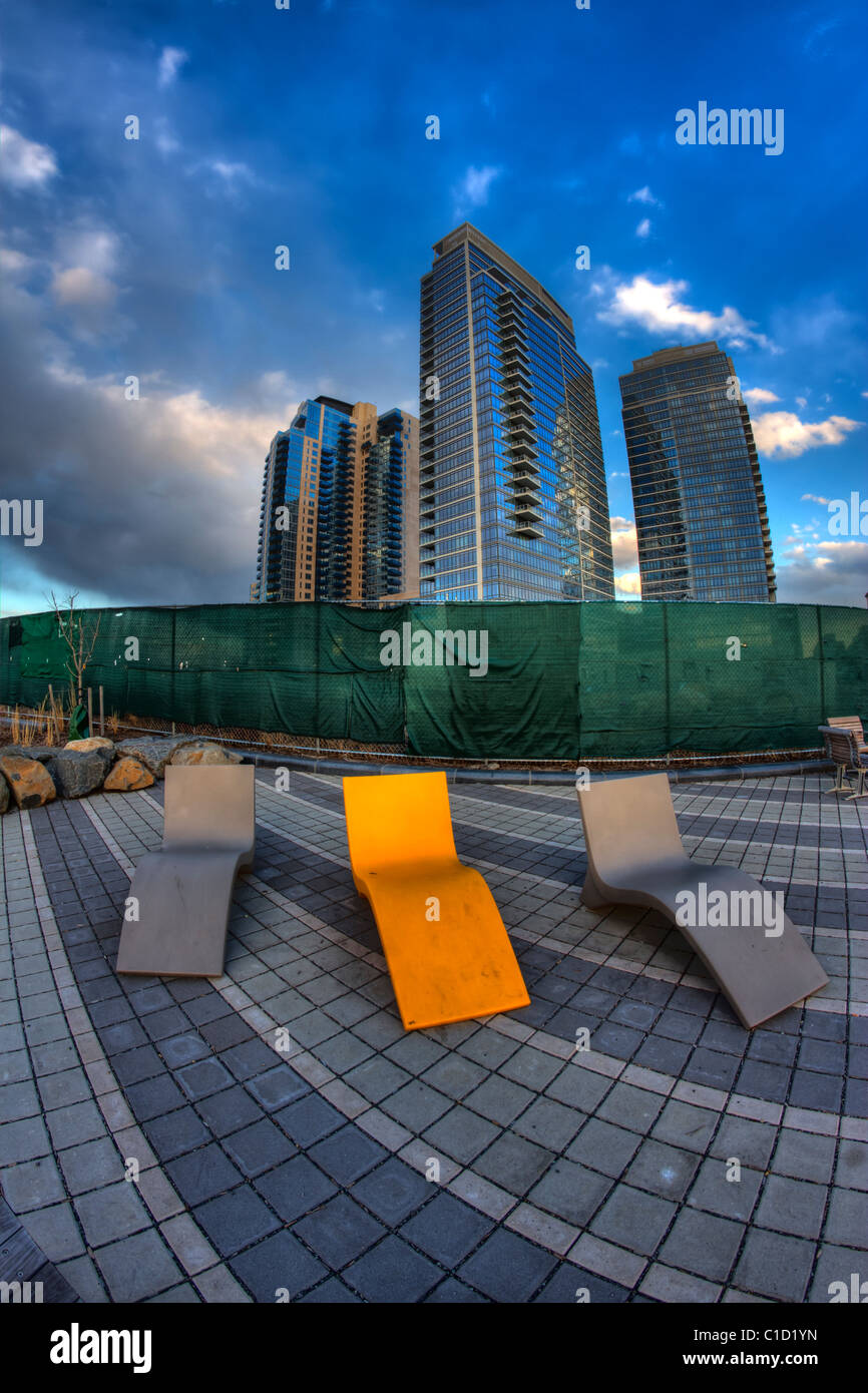 Fisheye view of a bright yellow deck chair at Northside Piers development in Williamsburg, Brooklyn Stock Photo