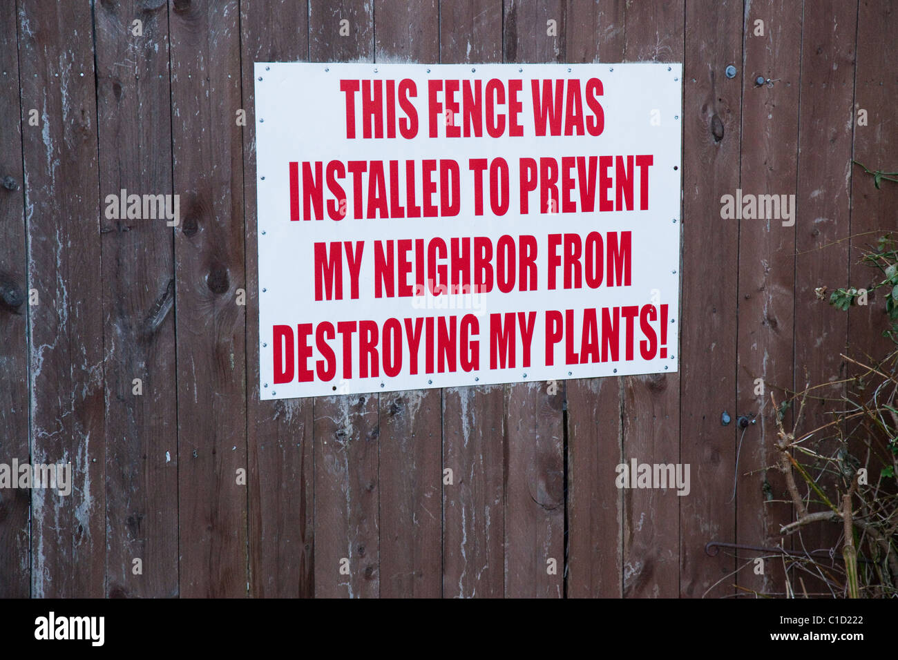 Fence with sign destroying plants Stock Photo Alamy