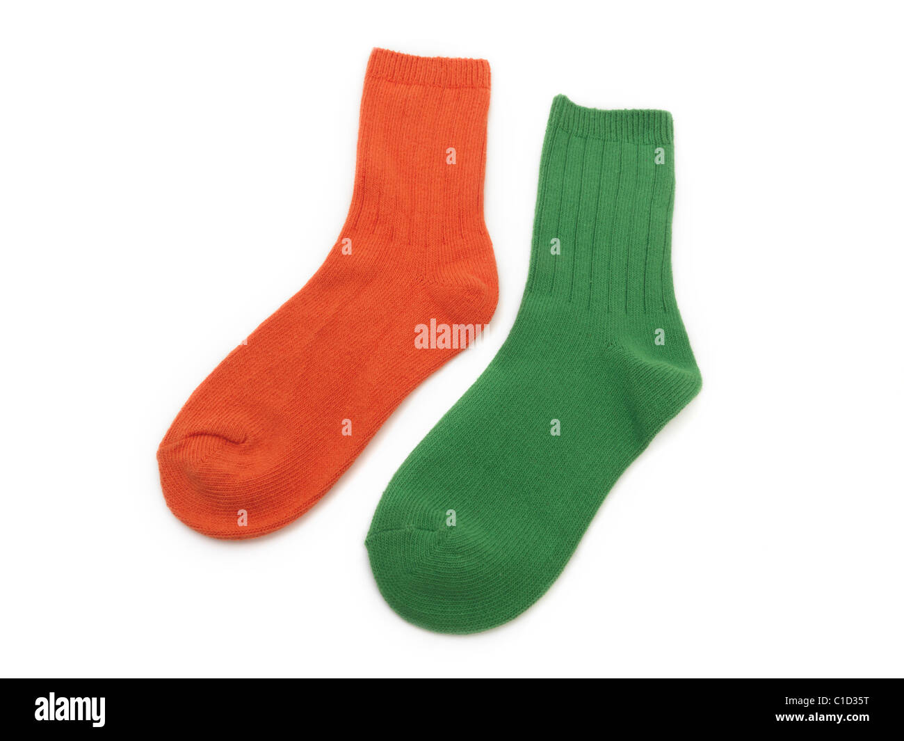 A Pair Of Children's Socks One Green And One Orange Stock Photo Alamy