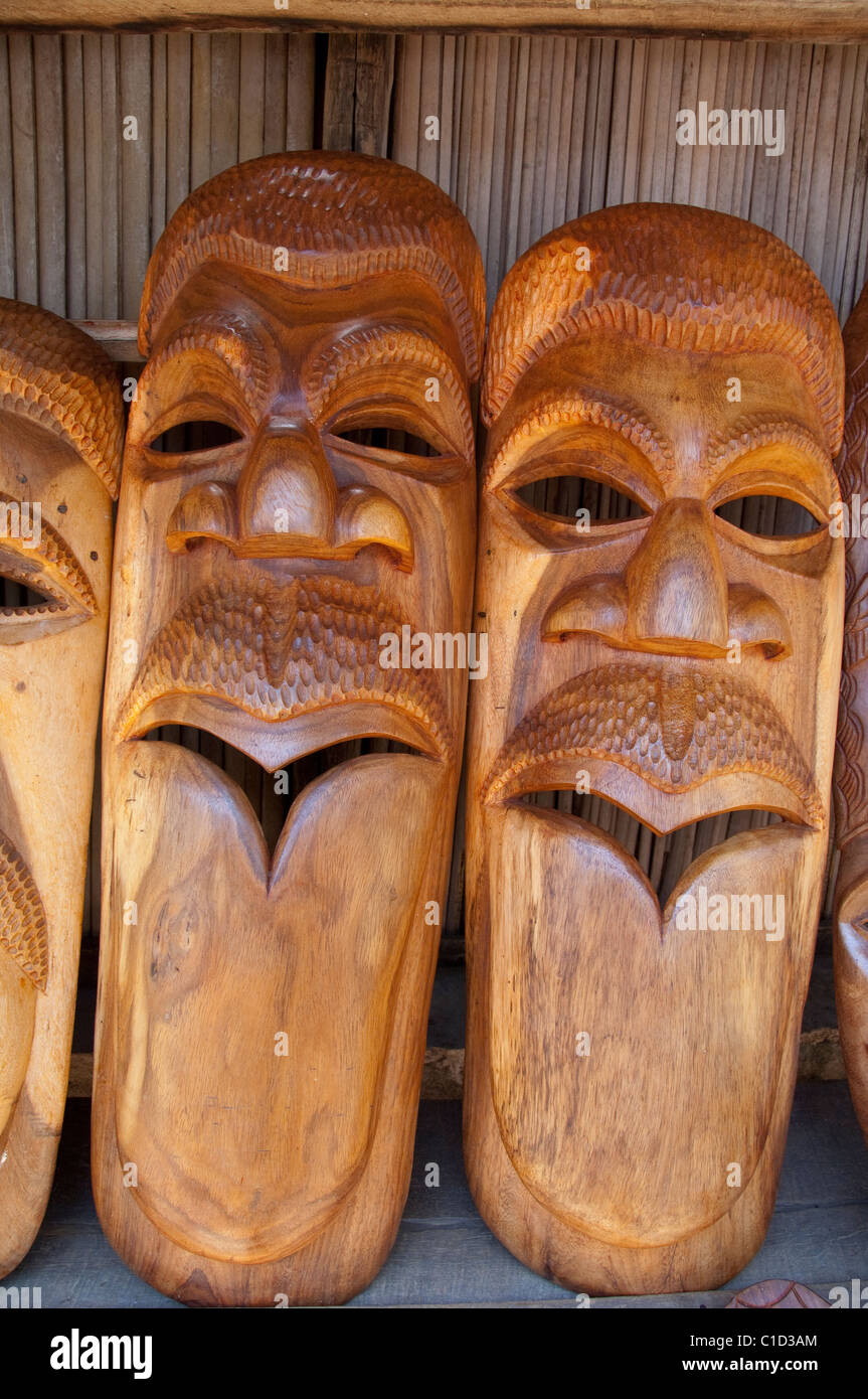 Madagascar, Island of Nosy Komba (next to Nosy Be) fishing village of  Ampangoriana. Typical souvenir wooden mask carvings Stock Photo - Alamy