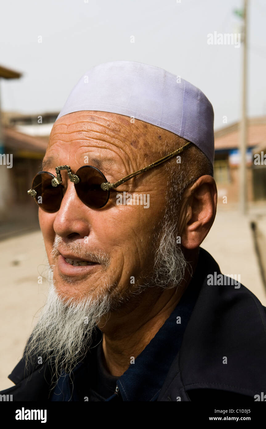 A Hui Muslim man wearing cool sunglasses Stock Photo Alamy