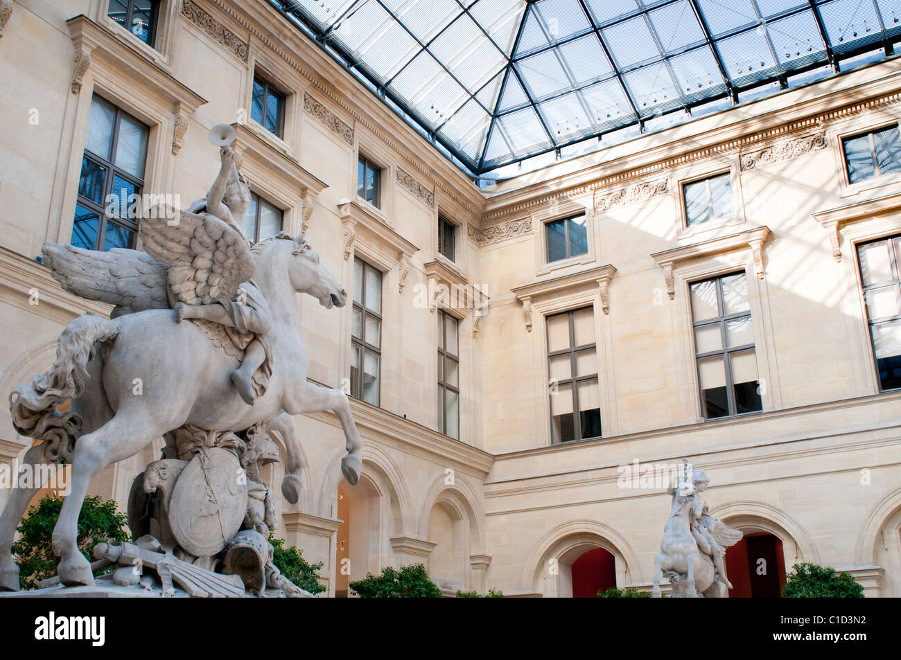 The open-air sculpture courtyard of Cour Marly at the Louvre in Paris