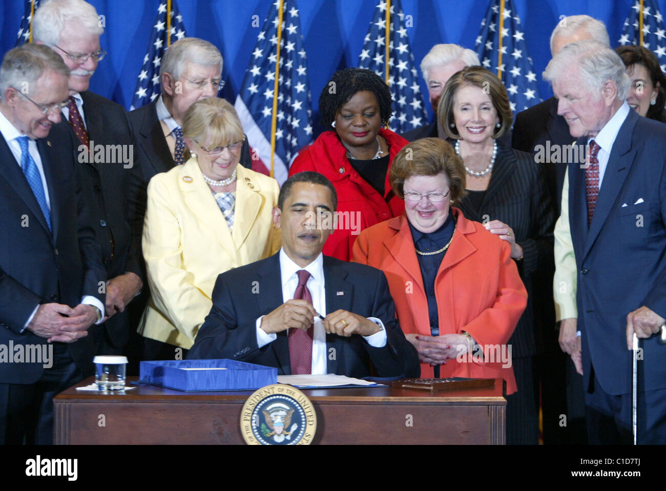 President Barack Obama signs the Edward M. Kennedy Serve America Act