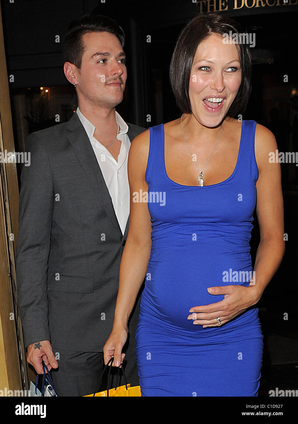 Matt Willis and his wife Emma Griffiths, who is sporting a rather large baby bump, spend the evening at the Dorchester Hotel Stock Photo