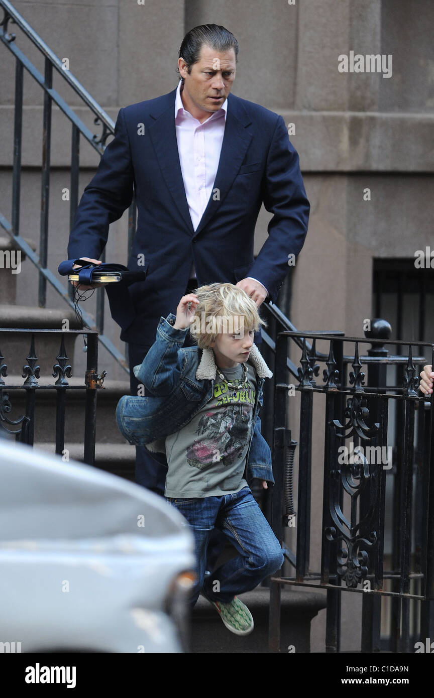 Arpad Busson leaves Uma Thurman's residence with Levon Roan Hawke on the way to school New York City, USA - 23.04.09 Stock Photo