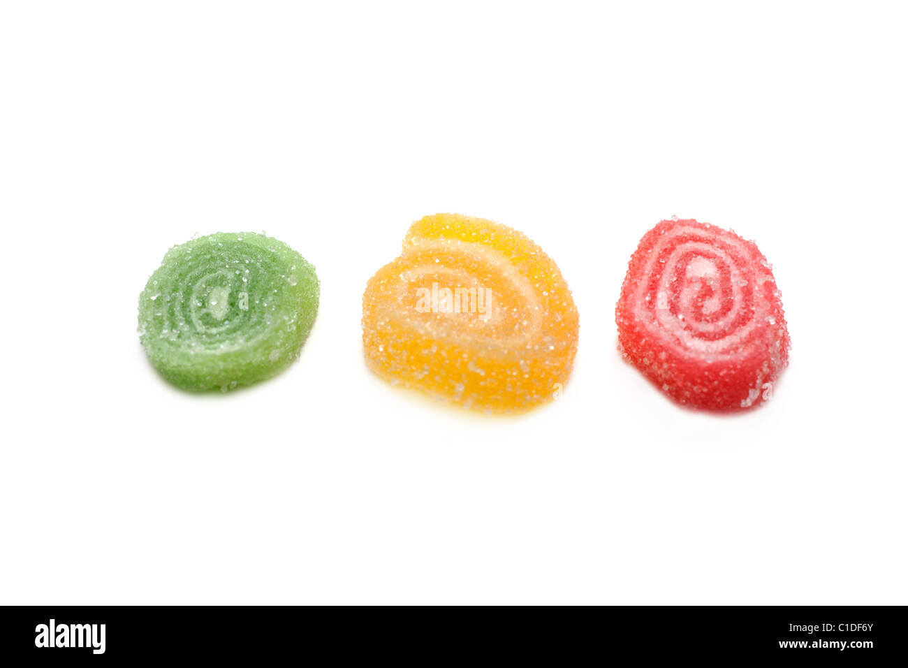 Colour fruit jellies in sugar on white background Stock Photo Alamy