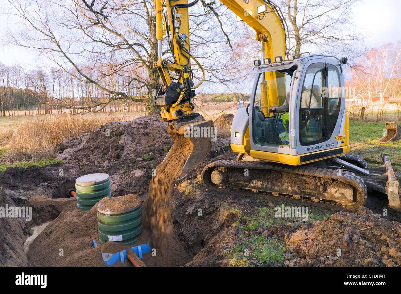 Excavator Digging Hole High Resolution Stock Photography and Images - Alamy