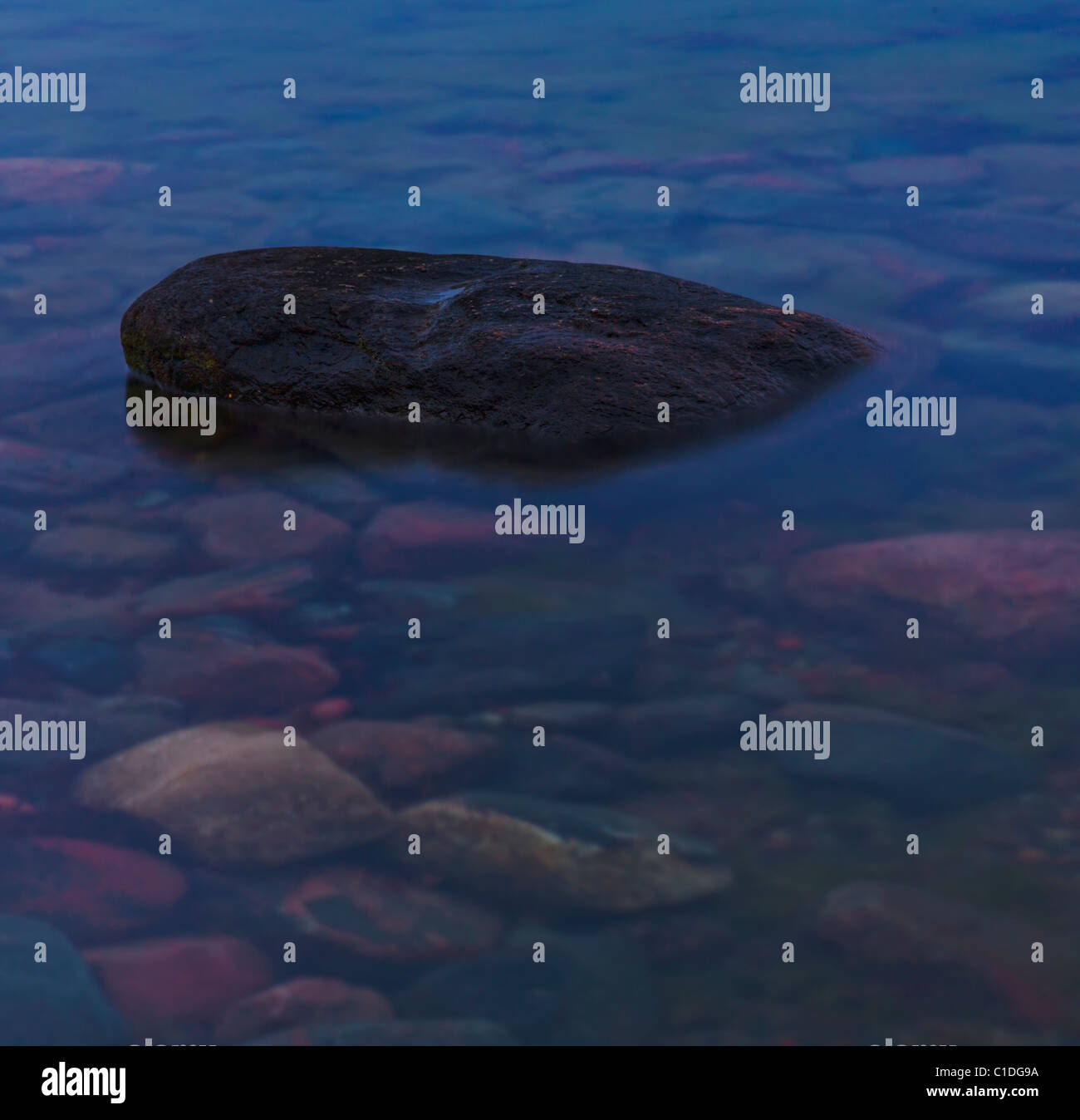 Stones in water Stock Photo - Alamy