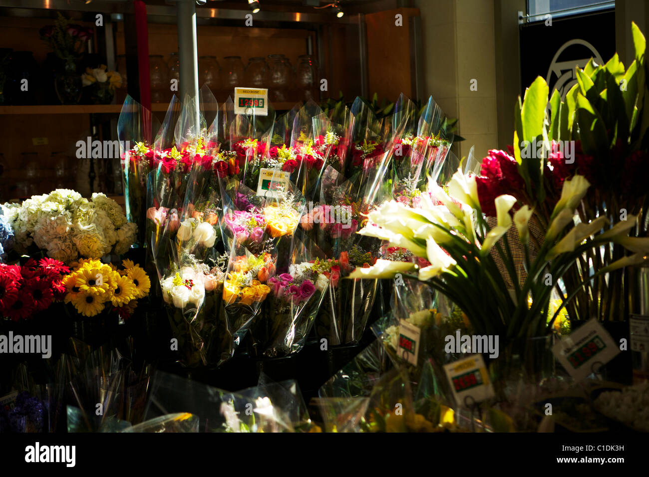 Bunches of flowers for sale outside a store or stall Stock Photo