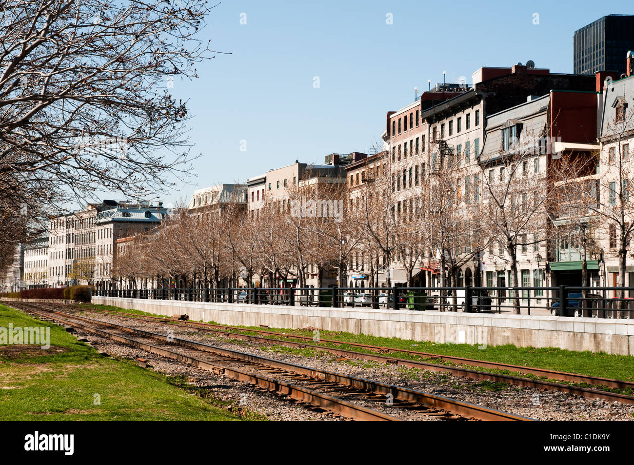 Train tracks follow the rue de la Commune through the Old Port of Montreal area.(Quebec, Canada) Stock Photo