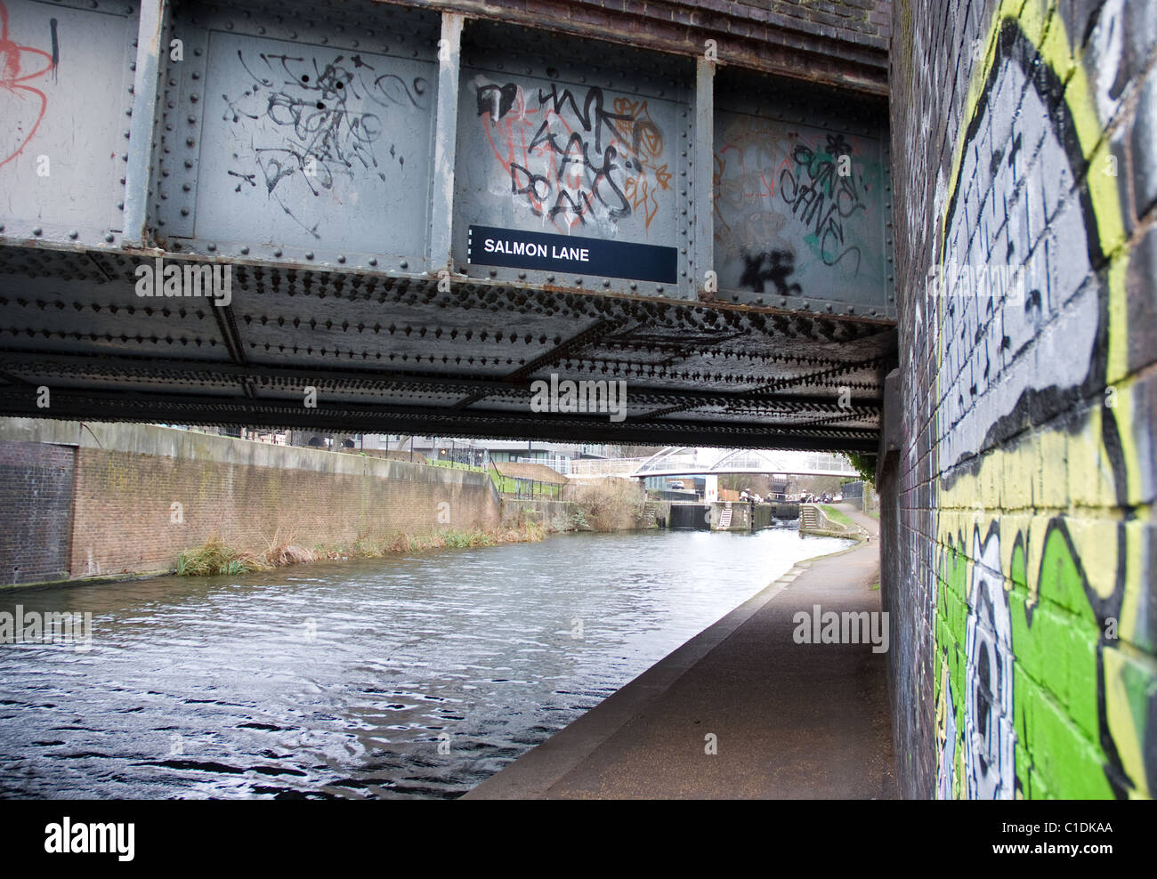 a grafitted wall and bridge along  the regents canal salmon lane , east london Stock Photo