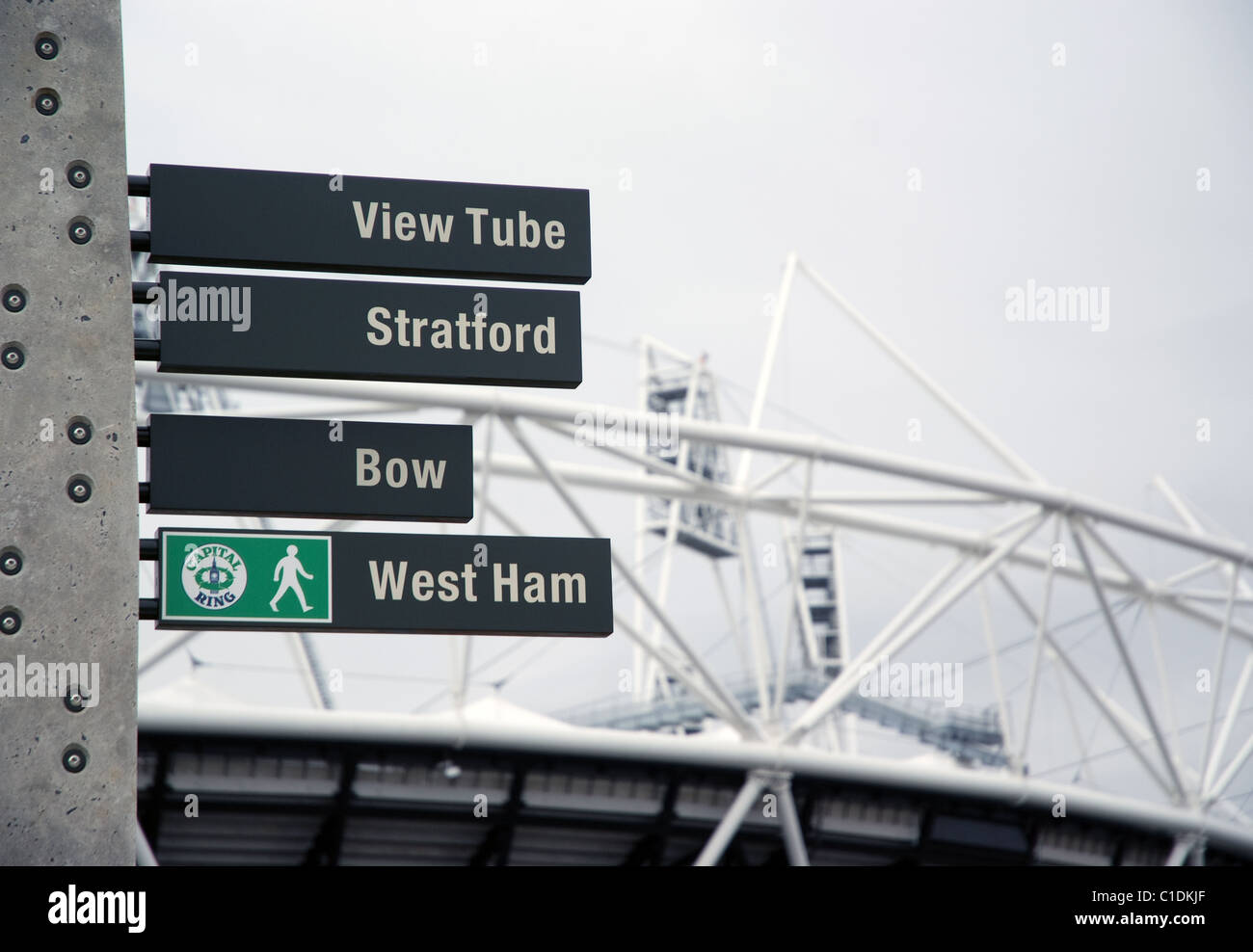 sign post along the green way with 2012 Olympic stadium in background Stock Photo