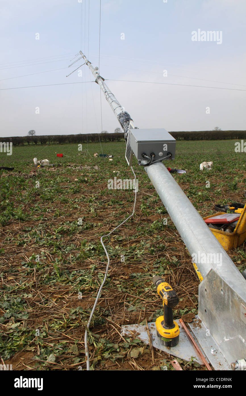 Windmonitoring meteorological mast (met mast) with data logger being