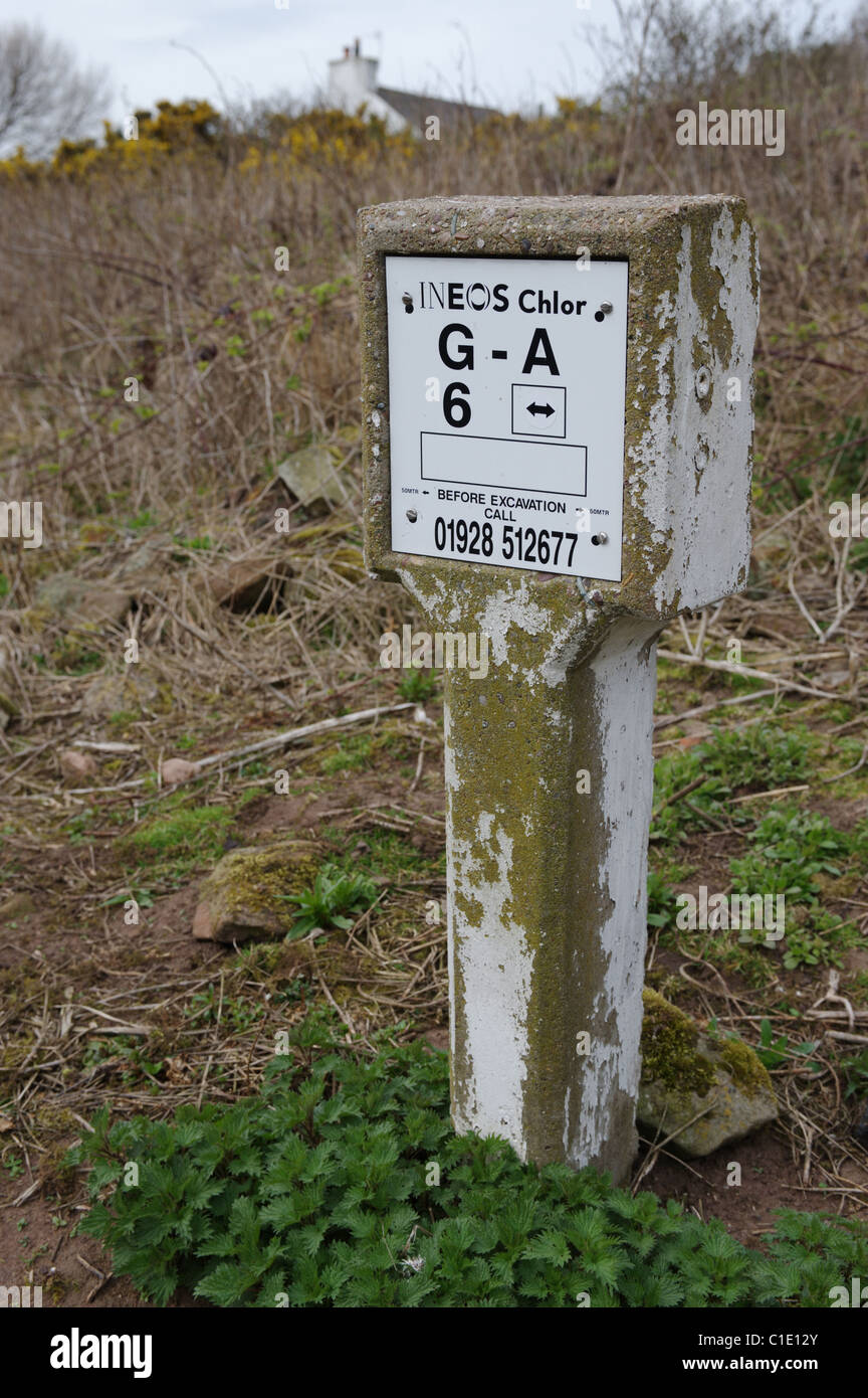 Sign indicating an underground bulk liquefied gas Chlorine pipeline in