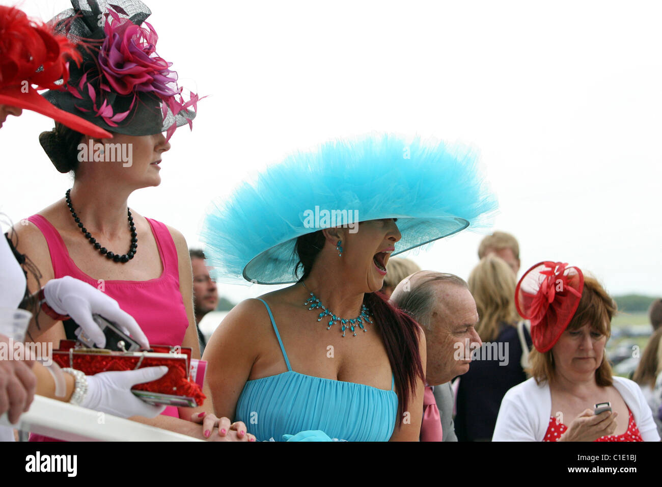 Women in hats at a horse race, Epsom, United Kingdom Stock Photo