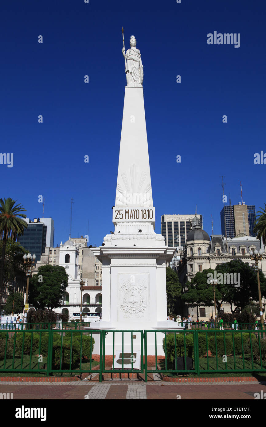 White marble statue of the [May Pyramid] 1811 shining in sun and clear blue sky ,[Plaza de Mayo] [Buenos Aires] Argentina Stock Photo