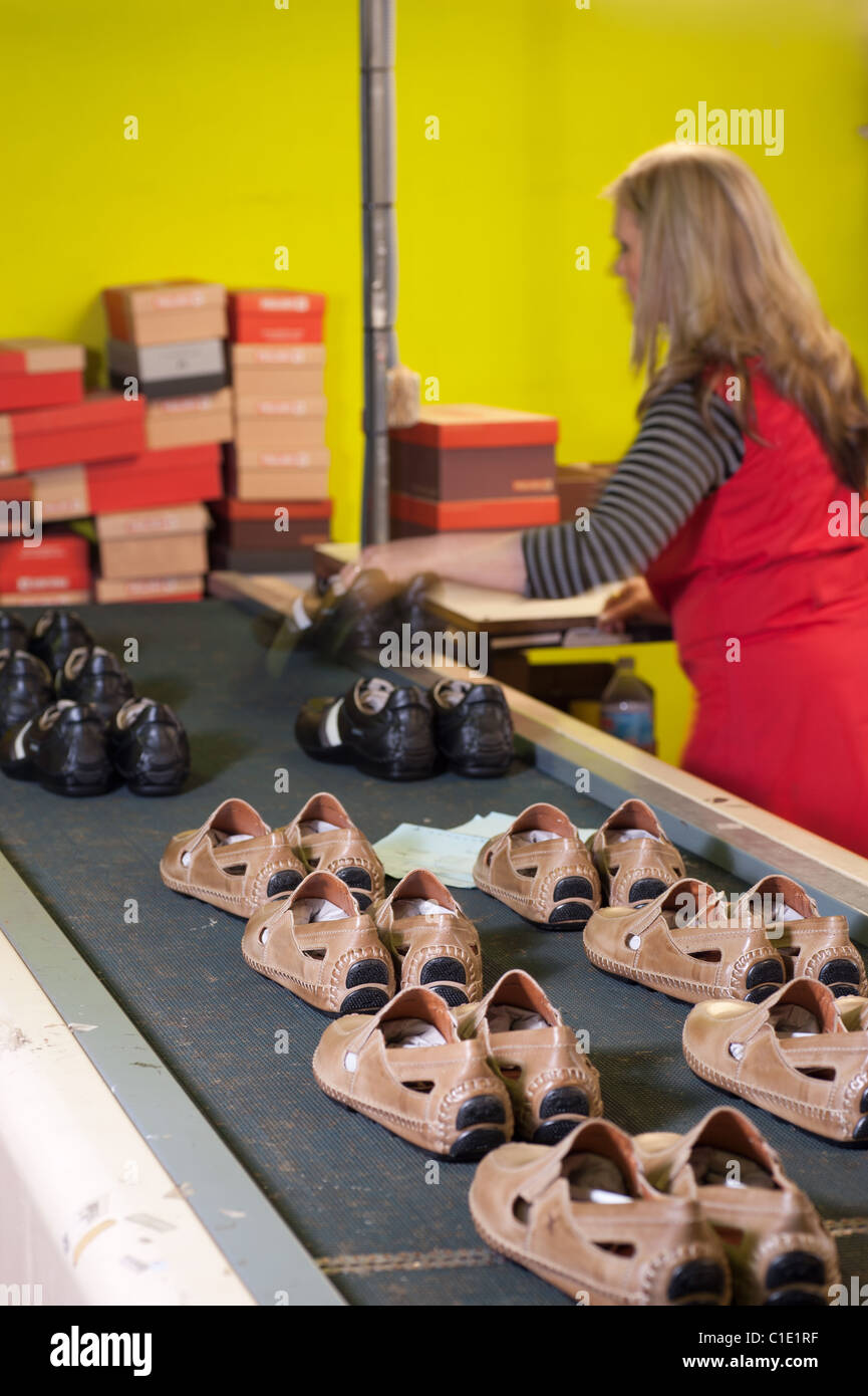 Footwear factory worker at the packaging station Stock Photo Alamy
