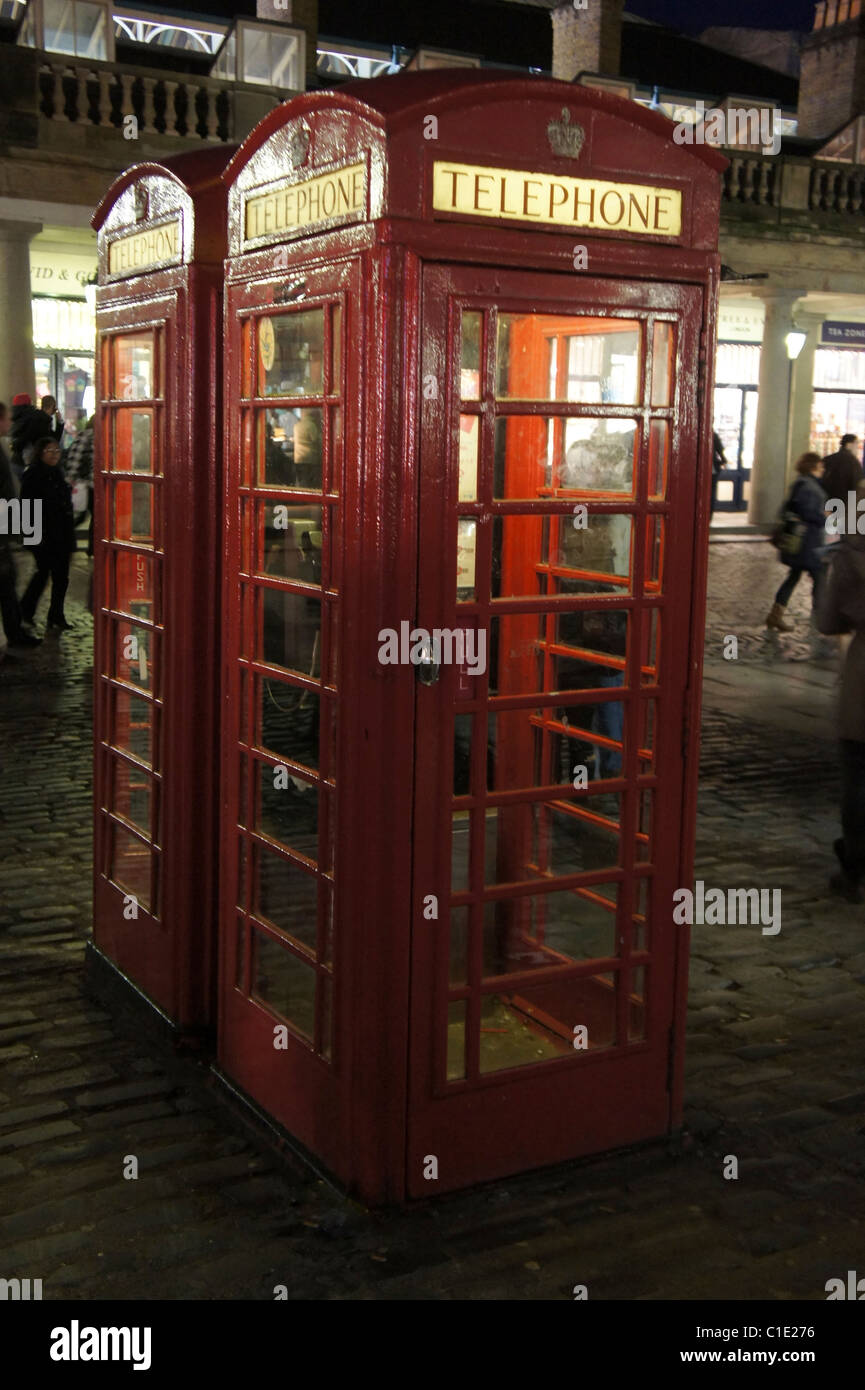 two British red telephone kiosks boxes, Covent Garden London, England Stock Photo