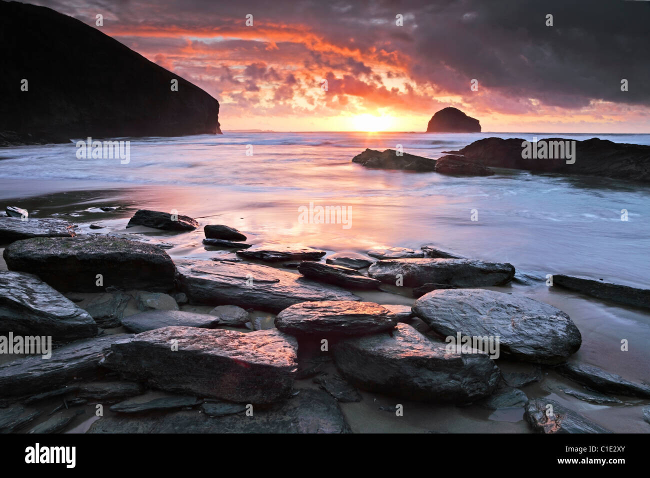 Sunset captured from the beach at Trebarwith Strand in North Cornwall Stock Photo