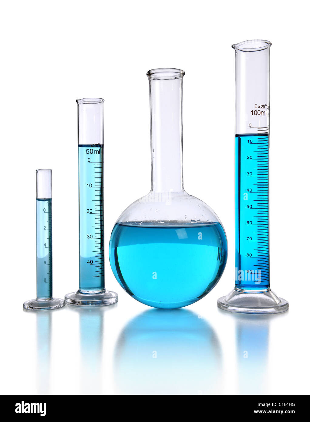 Laboratory glassware with blue liquid isolated over white background ...