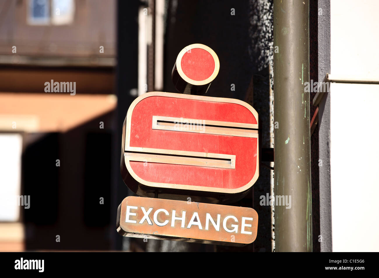 Exchange office sign under a bank agency sign of an austrian Sparkasse branch Stock Photo