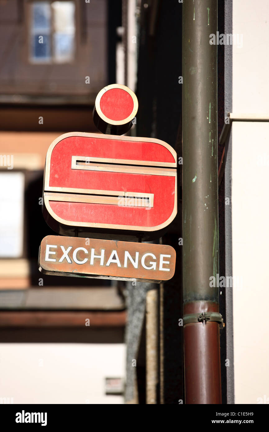 Exchange office sign under a bank agency sign of an austrian Sparkasse branch Stock Photo