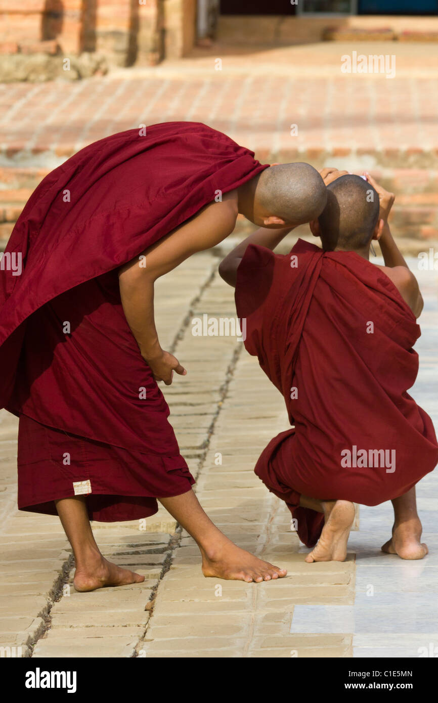 monks checking image in viewfinder of camera, Sulamani Temple,  Minnanthu village, southwest of Bagan, Burma Myanmar Stock Photo